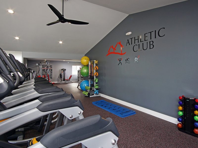 This image shows an expansive view of the 24-hour State-of-the-art fitness gym featuring different equipment that is essential for community amenities.